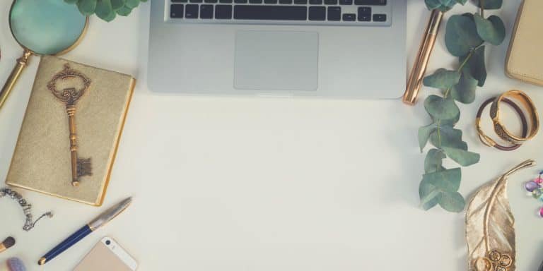 Golden Rules of Web Design - Laptop On Table With Golden Items
