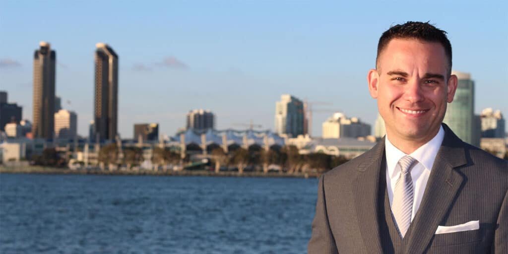 Real Estate Business Marketing Websites Real Estate Agent standing in front of a city skyline.