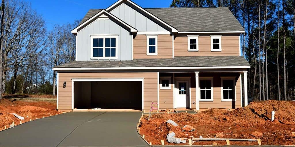 House under construction without garage door. House under construction without garage door.