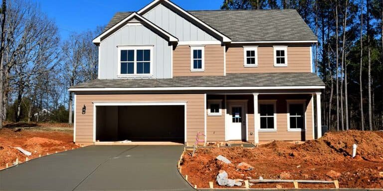 House under construction without garage door. House under construction without garage door.